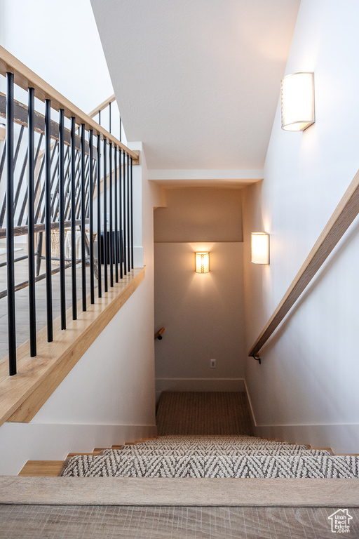 Staircase featuring baseboards