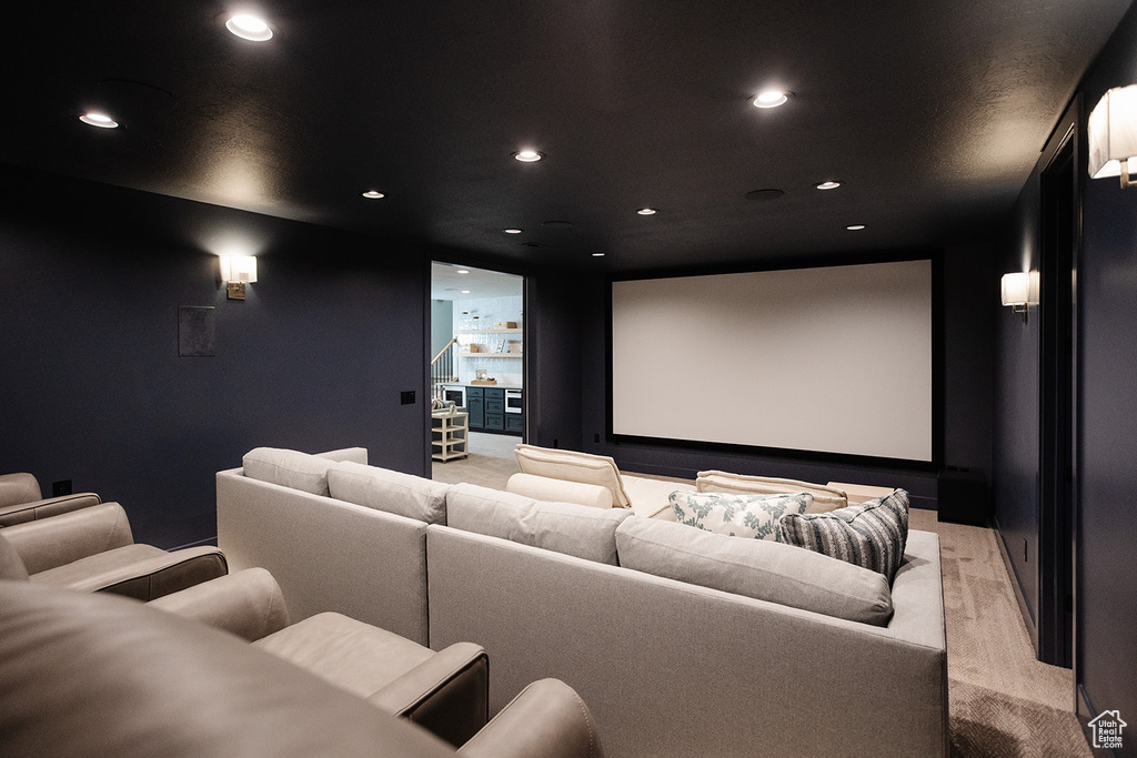 Cinema room with recessed lighting and light carpet