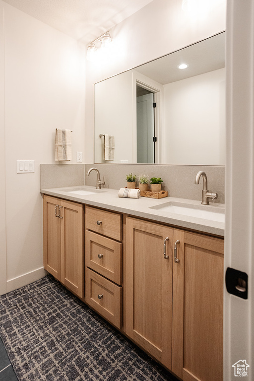 Full bathroom featuring double vanity