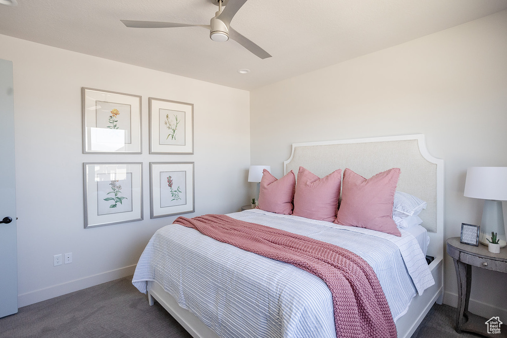 Bedroom featuring carpet, baseboards, and a ceiling fan