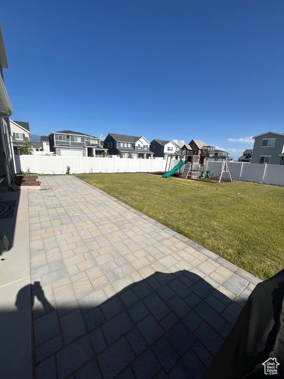 View of patio / terrace with a playground and a residential view