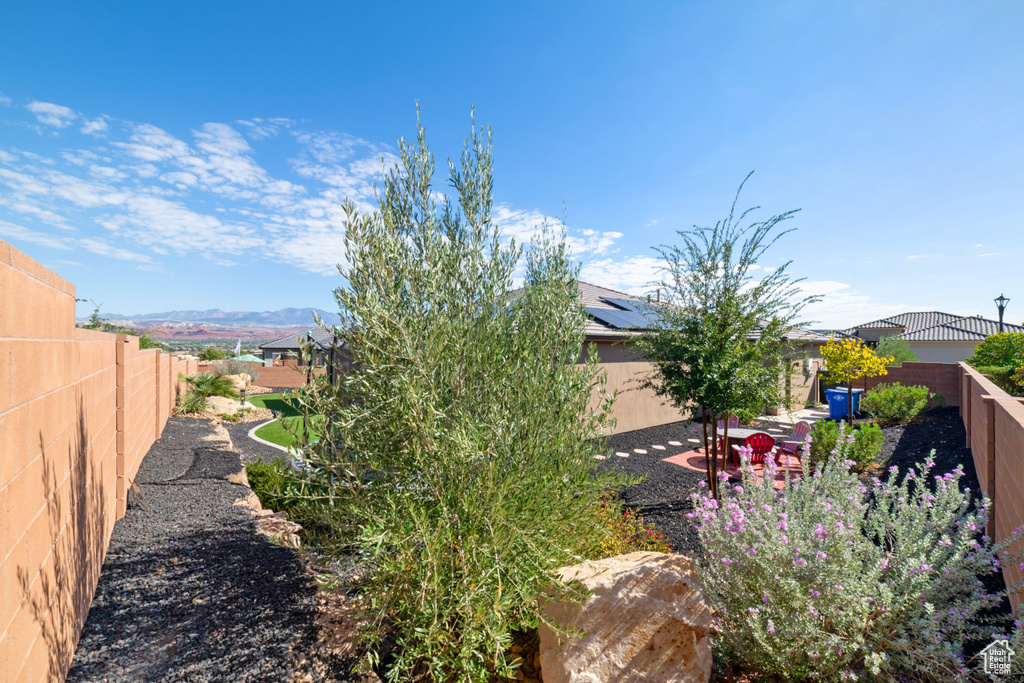 Fenced backyard with a mountain view