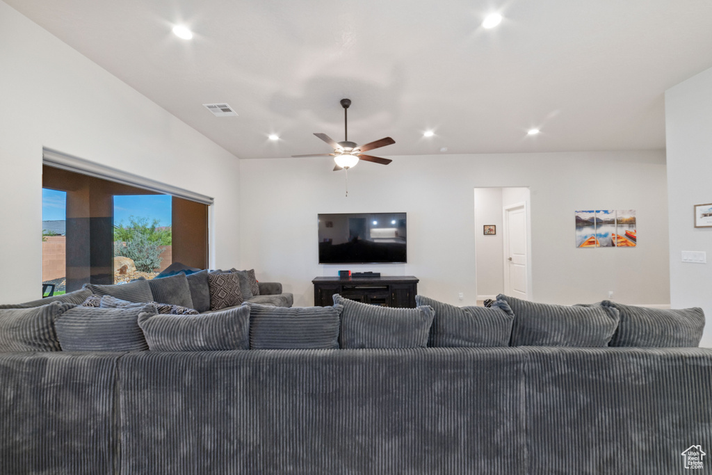Living area with a ceiling fan and recessed lighting