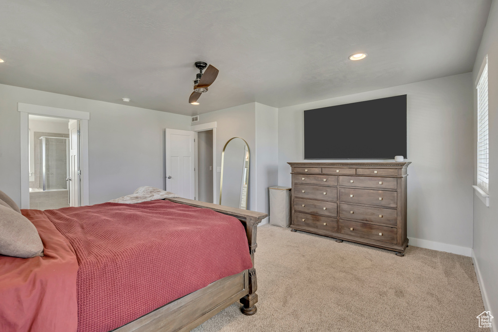 Carpeted bedroom with recessed lighting, a ceiling fan, ensuite bath, and baseboards