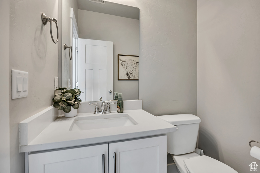 Bathroom featuring toilet and vanity