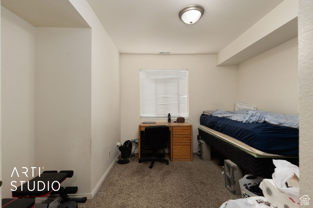 Carpeted bedroom with baseboards