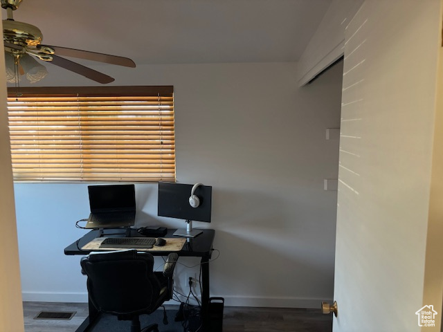 Office featuring ceiling fan, baseboards, and wood finished floors