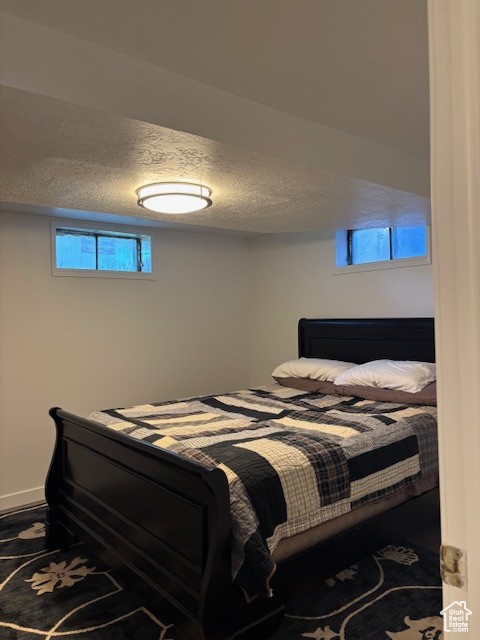 Bedroom featuring a textured ceiling