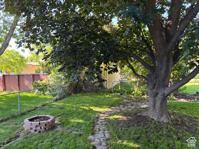 View of yard featuring a fire pit
