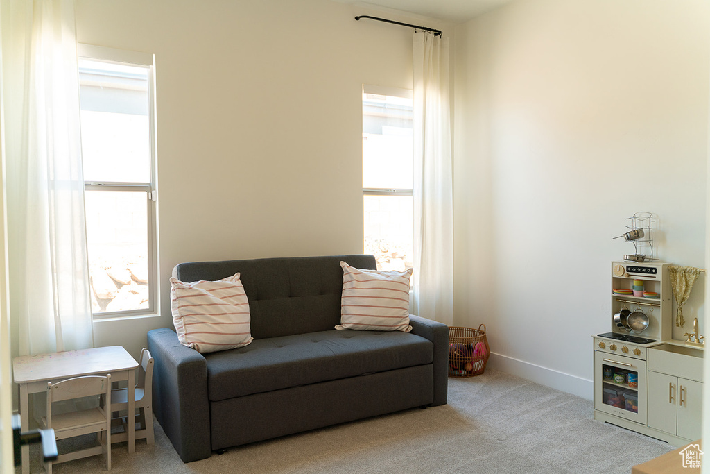Living area with carpet floors and baseboards