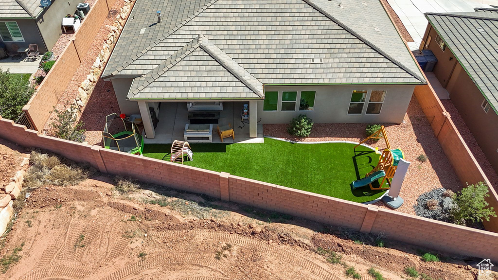 Rear view of property featuring a patio and stucco siding