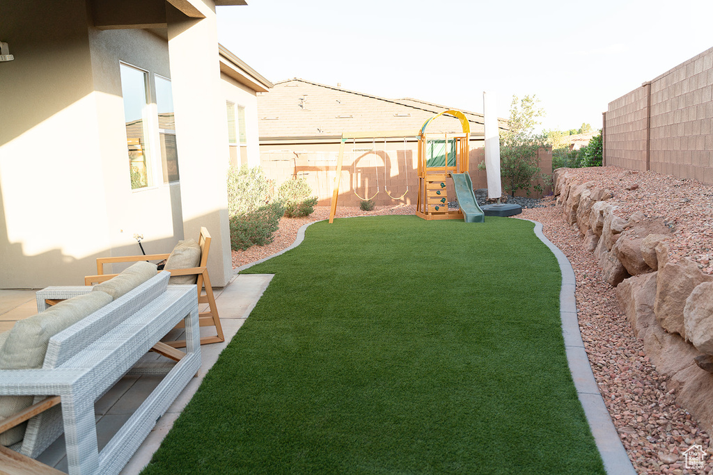 View of yard featuring a playground