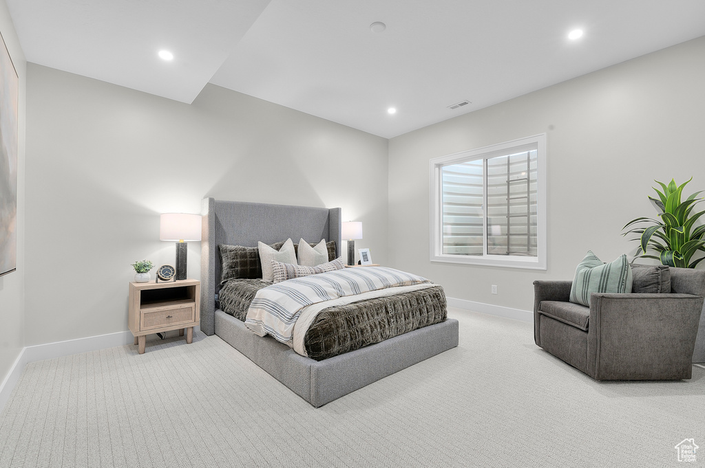 Carpeted bedroom featuring baseboards and recessed lighting