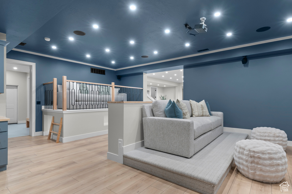 Cinema with wood finished floors, baseboards, and recessed lighting