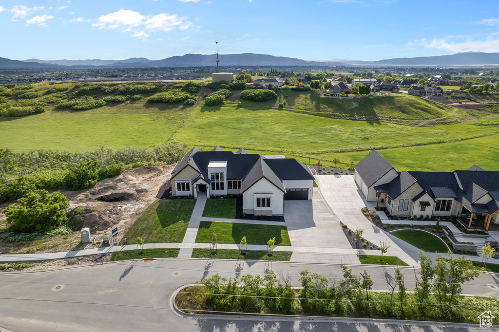 View of subject property with a mountainous background