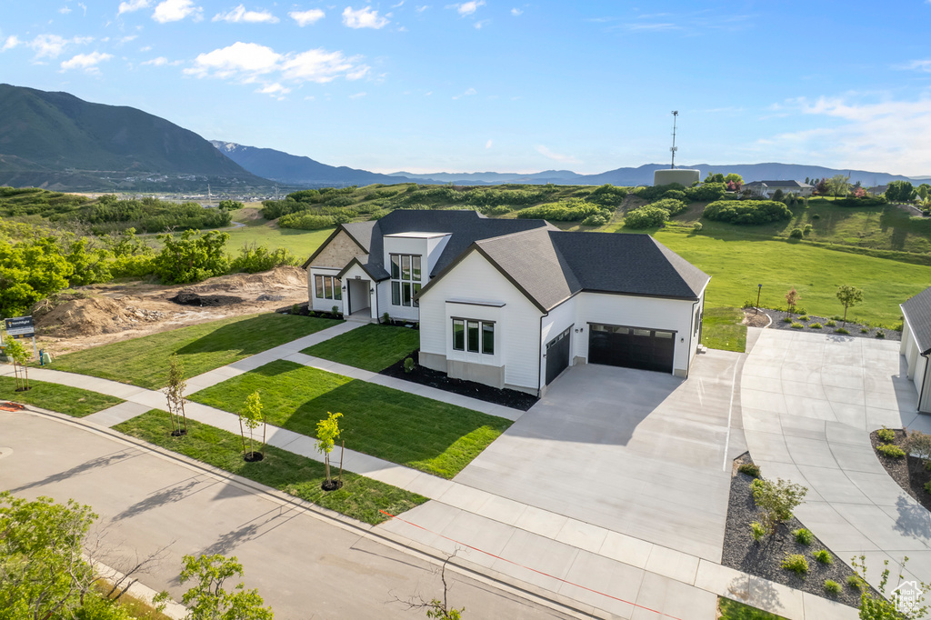 View of subject property featuring mountains