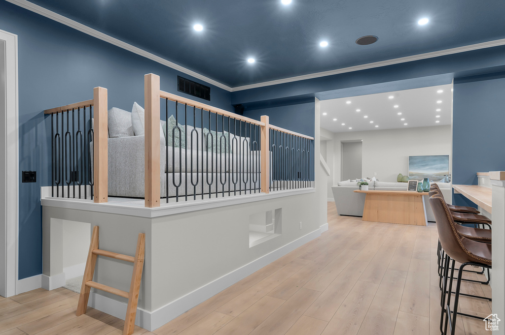 Interior space featuring wood finished floors, baseboards, and recessed lighting