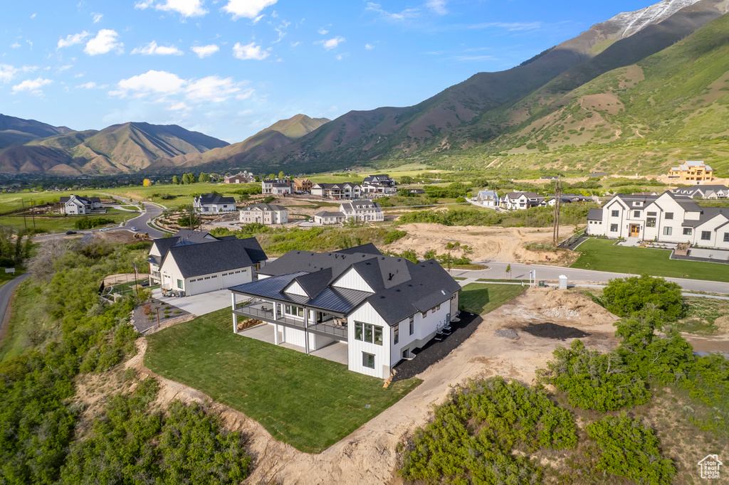 Aerial perspective of suburban area featuring a mountainous background