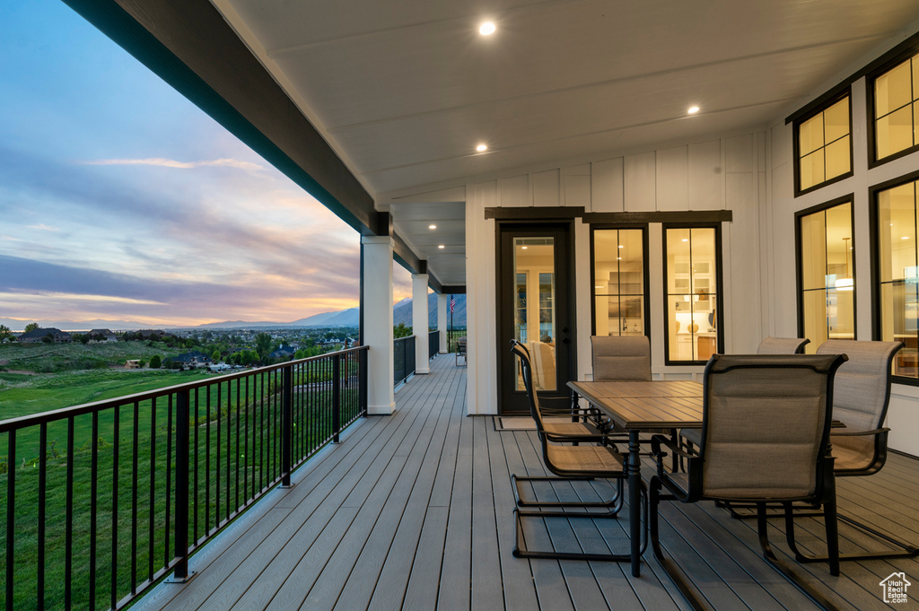 Deck featuring a mountain view and outdoor dining area
