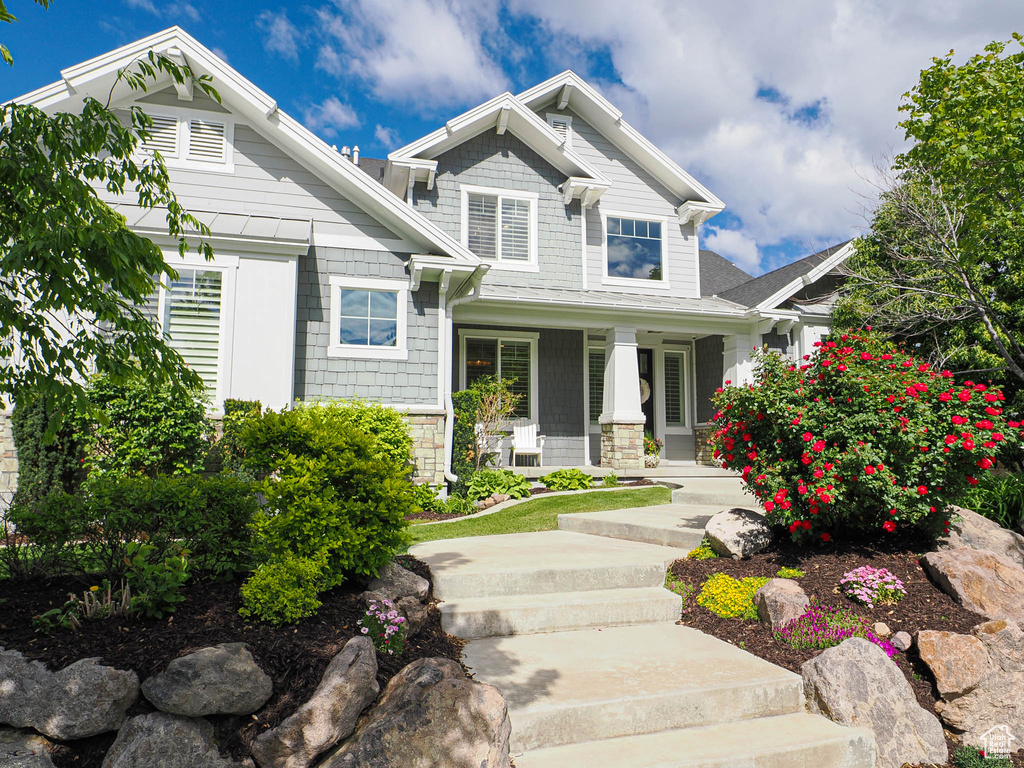 Craftsman inspired home featuring a porch