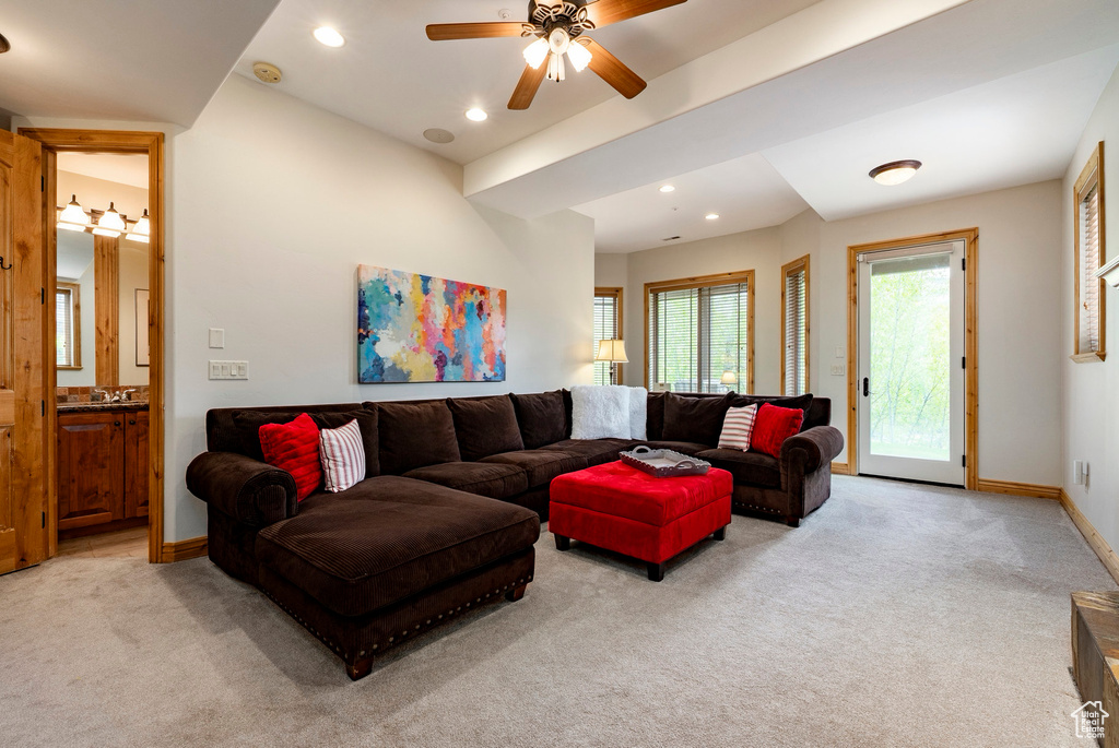 Living room with light colored carpet, recessed lighting, baseboards, and ceiling fan