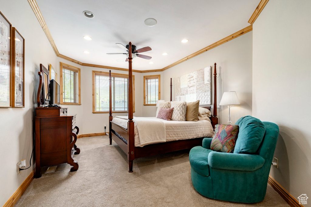 Bedroom with crown molding, baseboards, light colored carpet, recessed lighting, and a ceiling fan