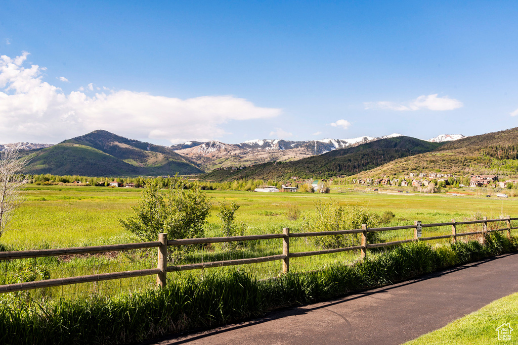 View of mountain backdrop with rural landscape and agricultural land