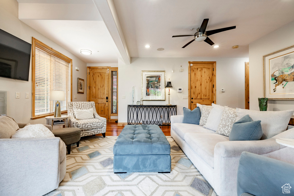 Living area with recessed lighting, ceiling fan, and wood finished floors