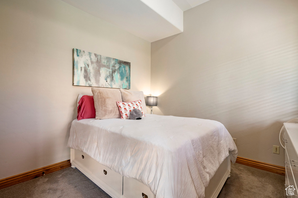 Bedroom with carpet flooring and baseboards