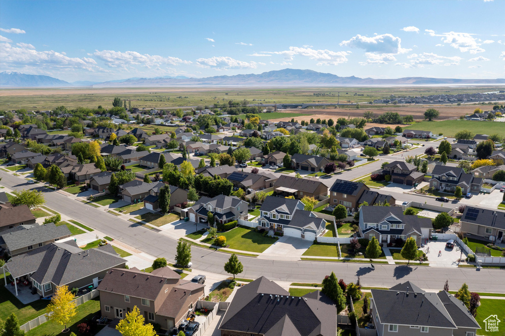 Aerial view of residential area featuring a mountain backdrop