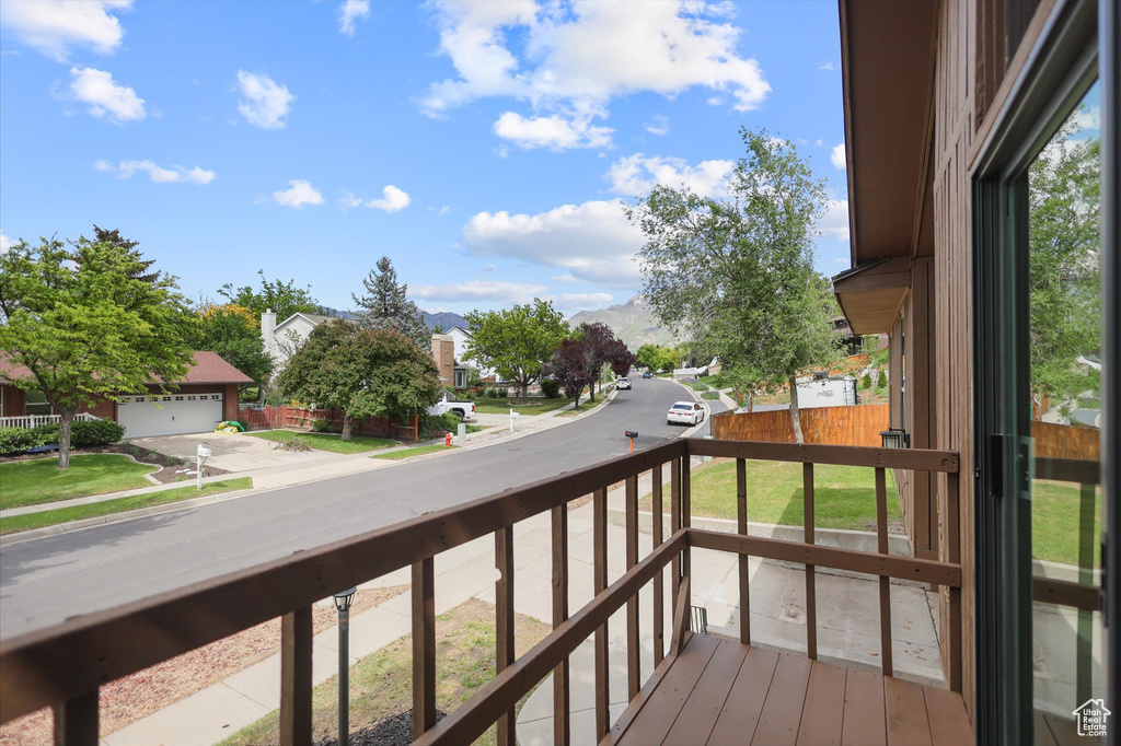 Balcony with a residential view and a mountain view