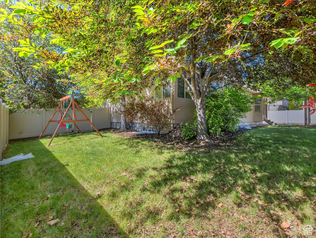 View of yard featuring a playground