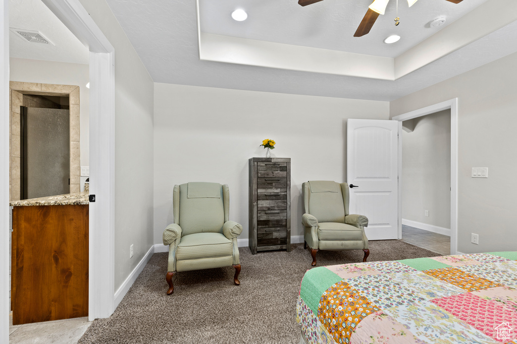 Bedroom featuring wine cooler, carpet, baseboards, and connected bathroom