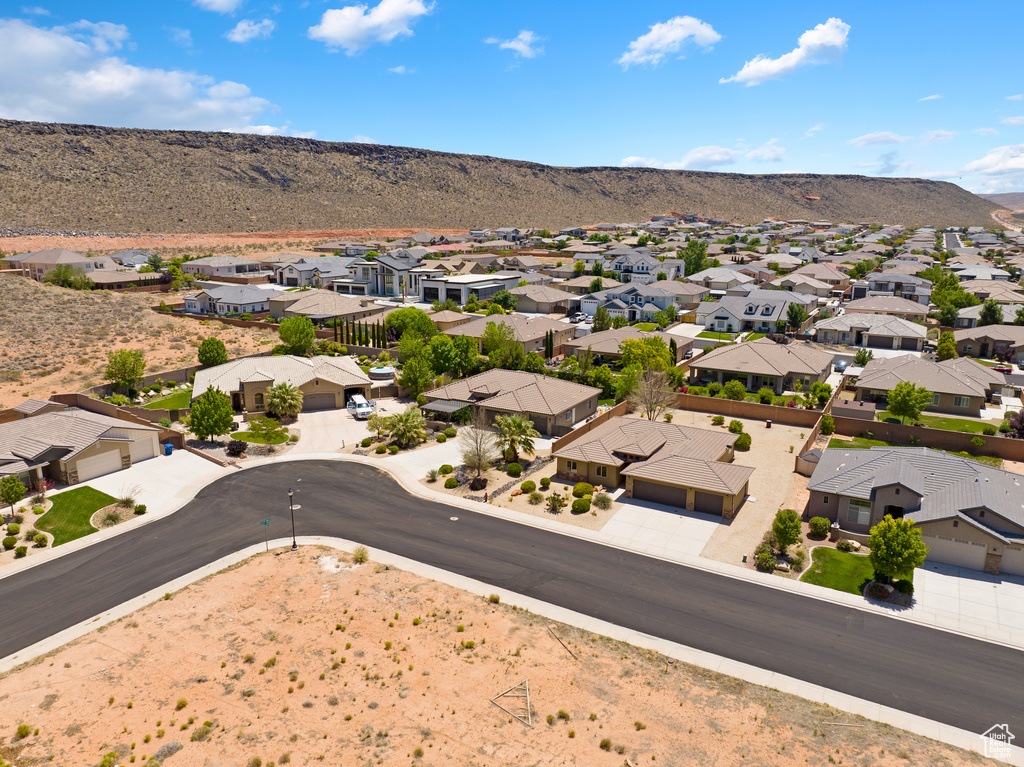 Aerial view of residential area featuring a mountainous background