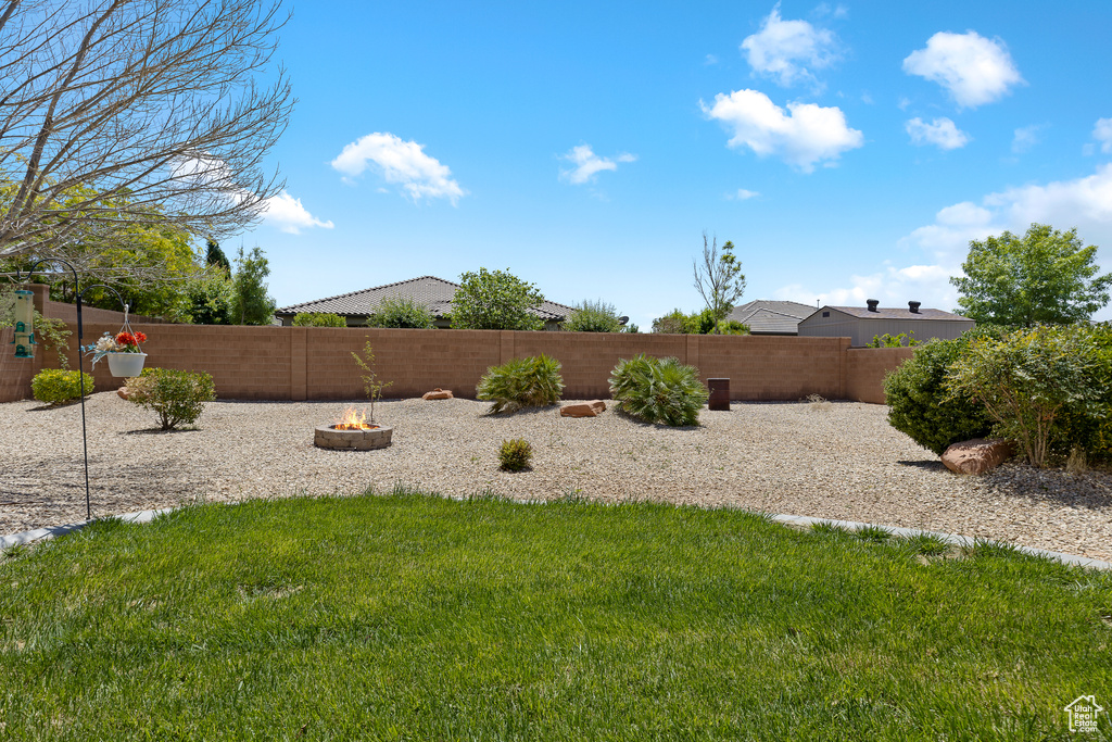 View of yard featuring a fire pit