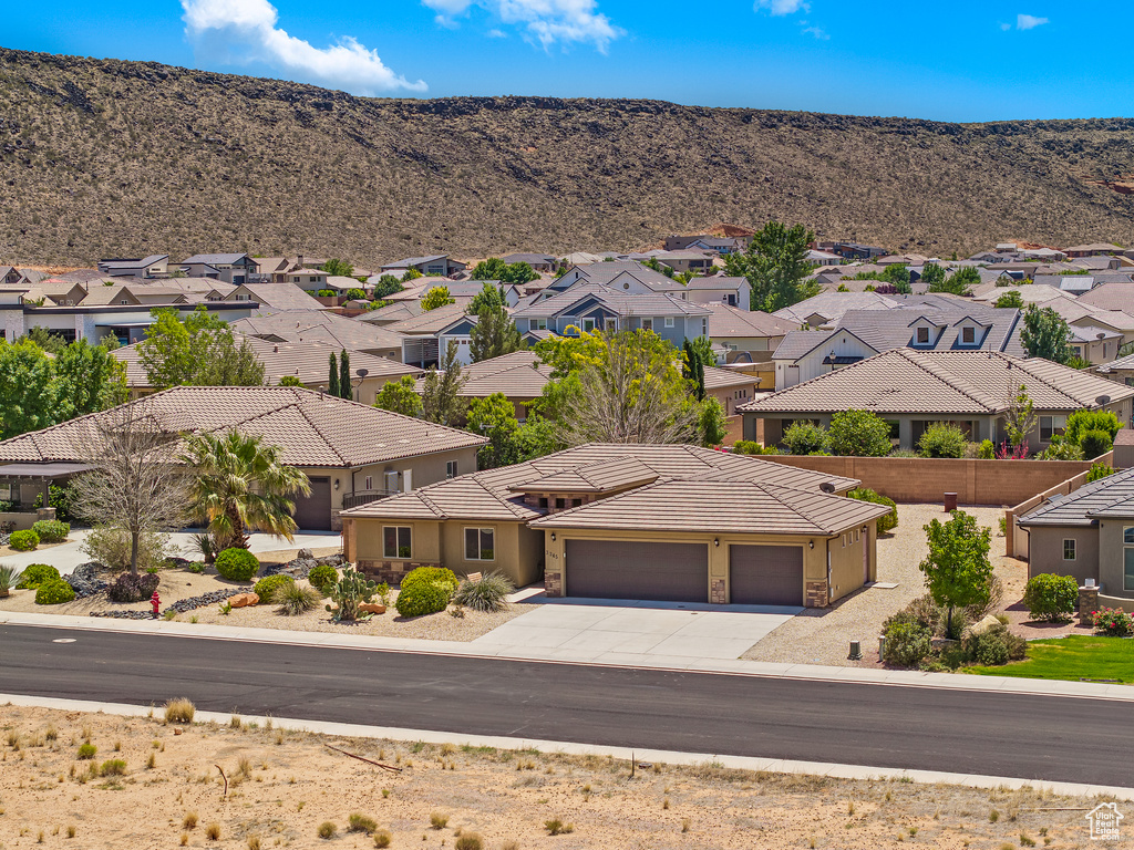 Aerial view of residential area featuring a mountain backdrop
