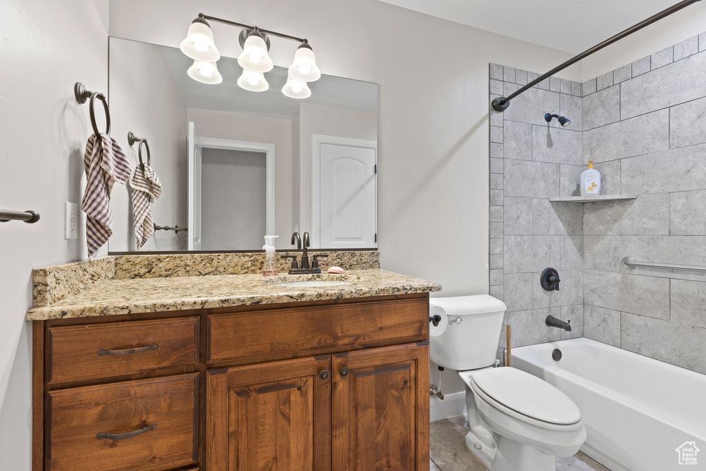 Full bath with toilet, vanity, and tub / shower combination