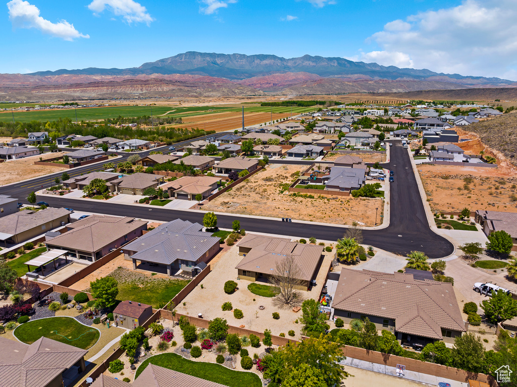 Aerial perspective of suburban area featuring a mountainous background