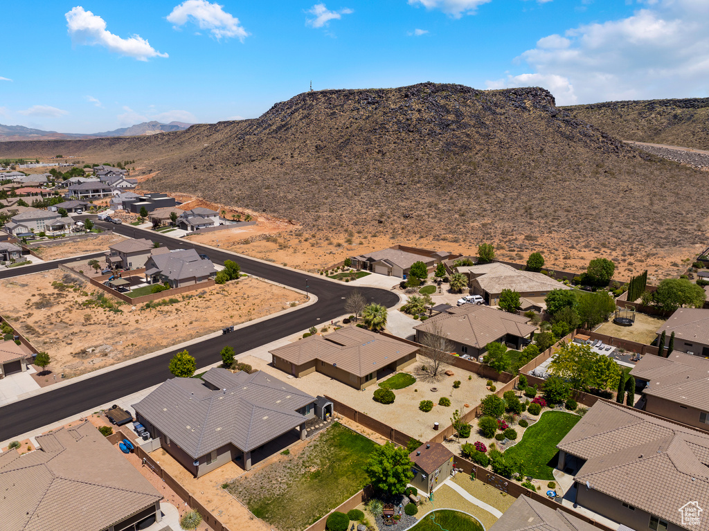 Aerial view of residential area featuring a mountain backdrop