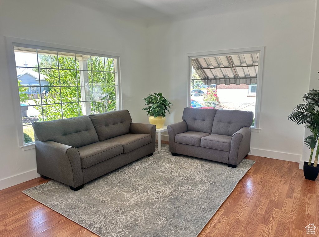 Living area featuring wood finished floors and baseboards