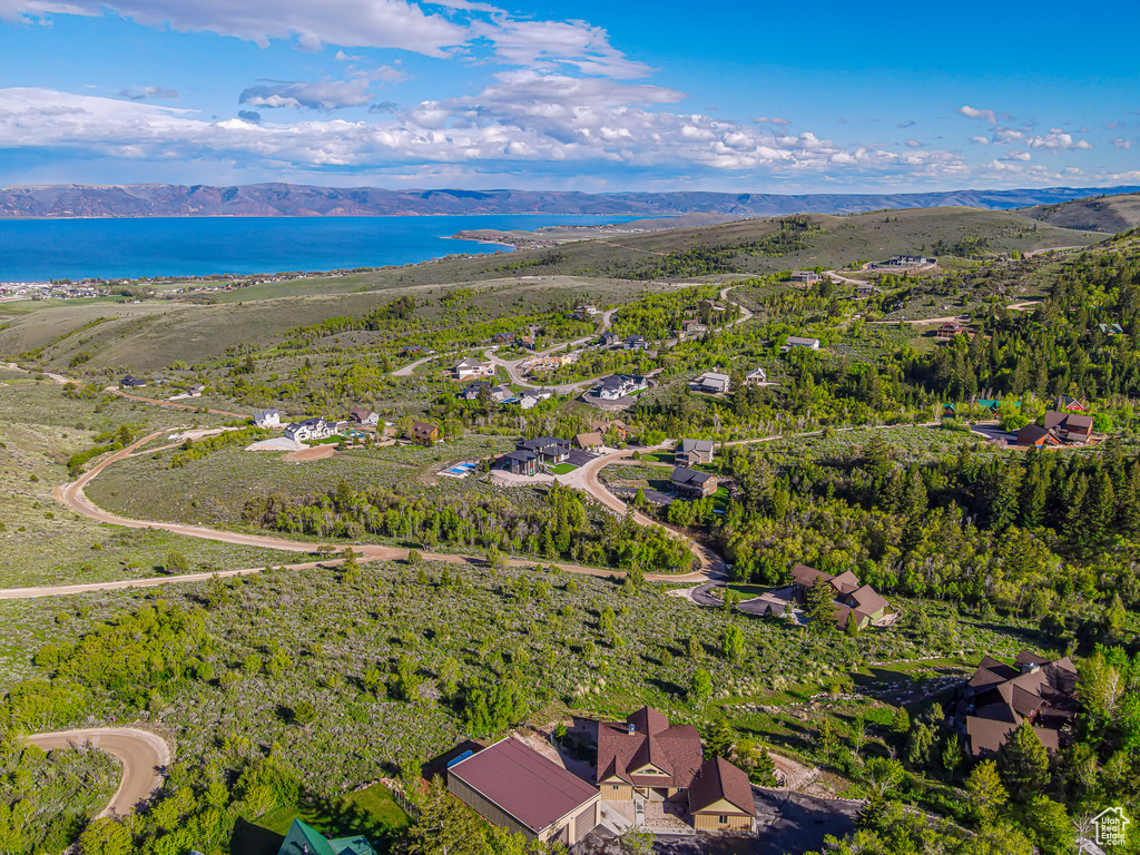 View of property location with a water and mountain view