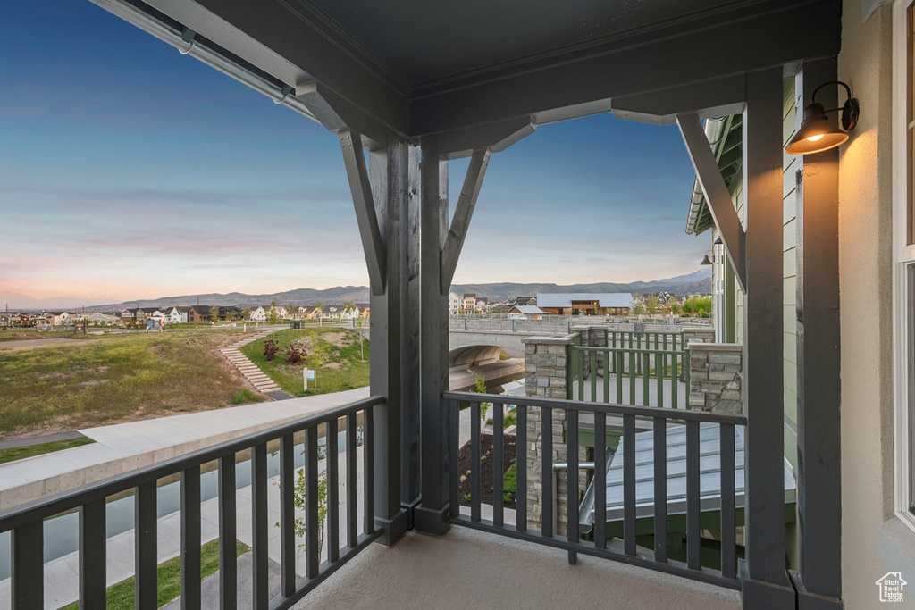 Balcony at dusk with a mountain view
