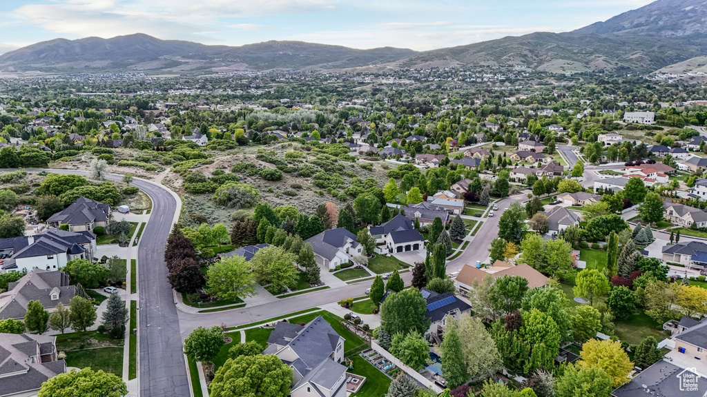 Aerial perspective of suburban area with a mountain backdrop