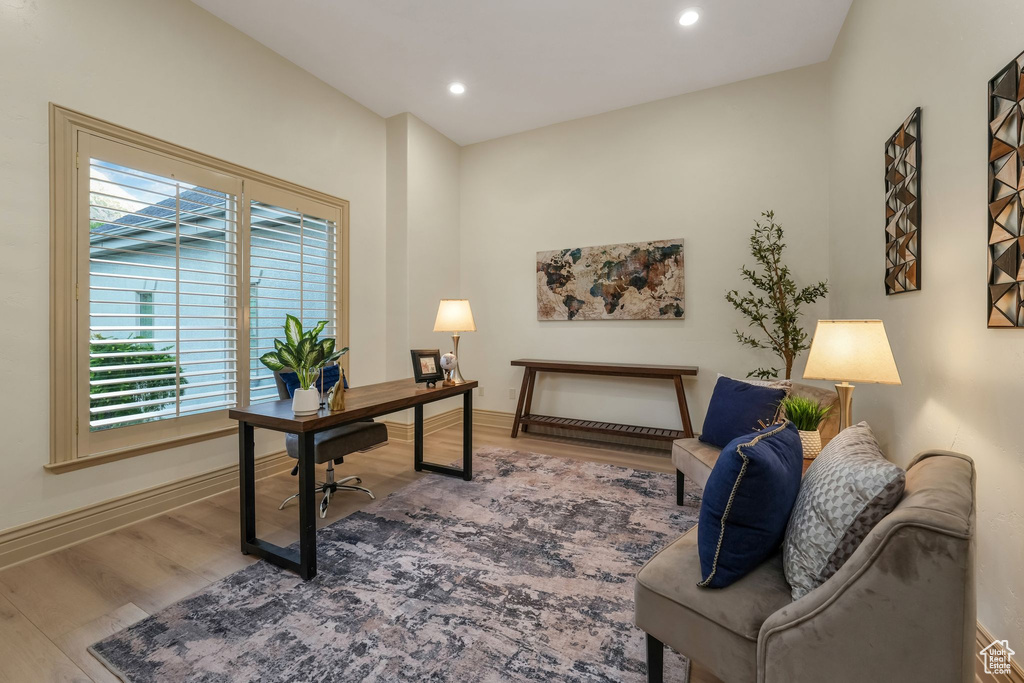 Office with wood finished floors, recessed lighting, and baseboards