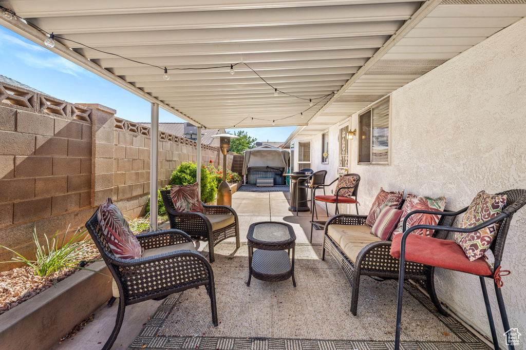 Fenced backyard with a patio area and an outdoor hangout area