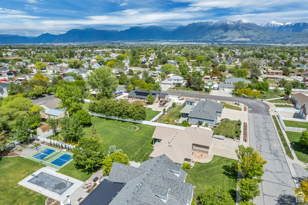 Aerial perspective of suburban area with a mountainous background