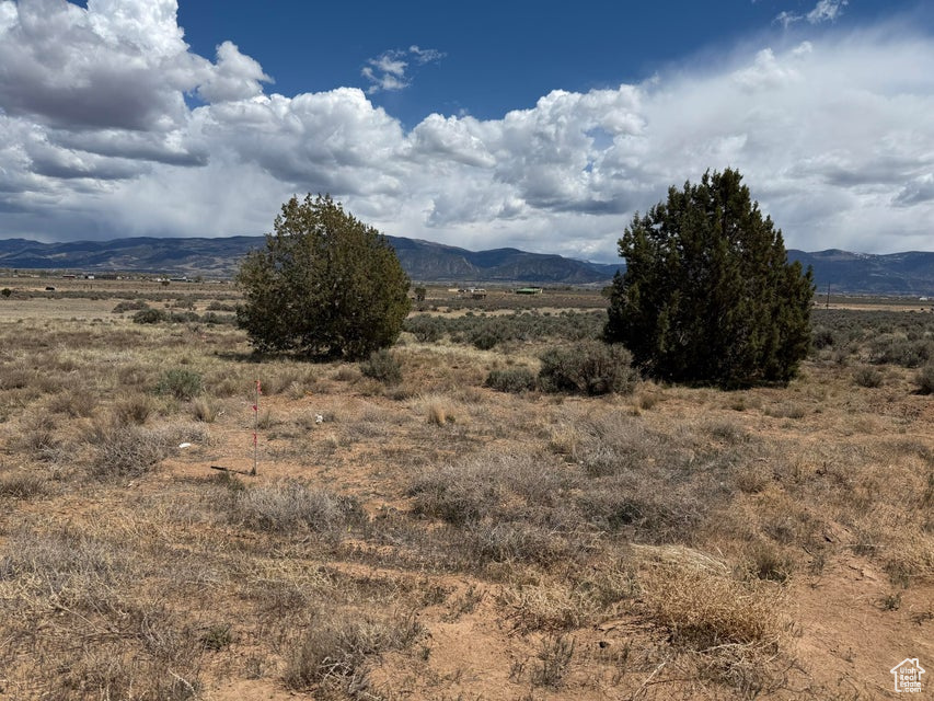 View of mountain backdrop with rural landscape
