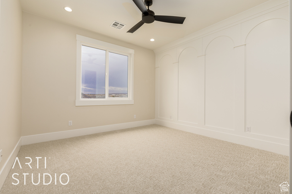 Unfurnished room featuring a ceiling fan, light colored carpet, recessed lighting, and baseboards