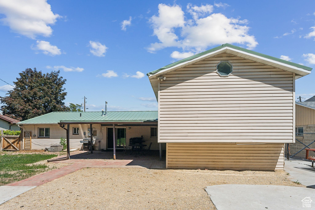 View of property exterior with a patio