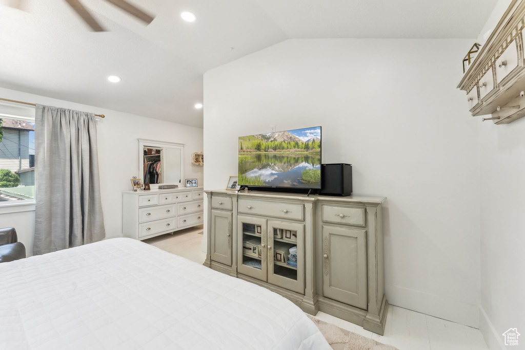 Bedroom featuring vaulted ceiling, recessed lighting, and ceiling fan